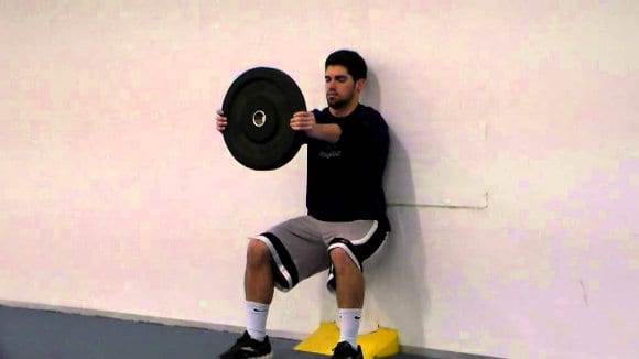 Allenamento, - wall sit: esercizio isometrico quadricipite